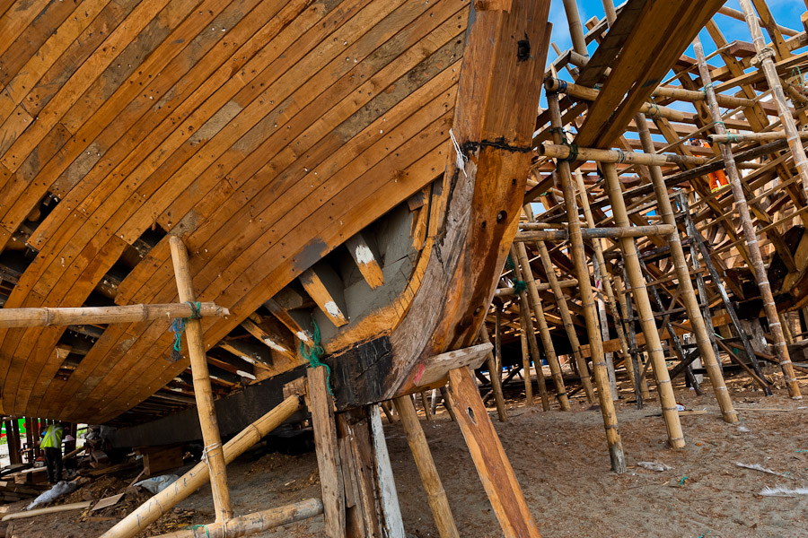 A wooden keel is seen during the construction process of a traditional fishing vessel in an artisanal shipyard on the beach in Manta, Ecuador.