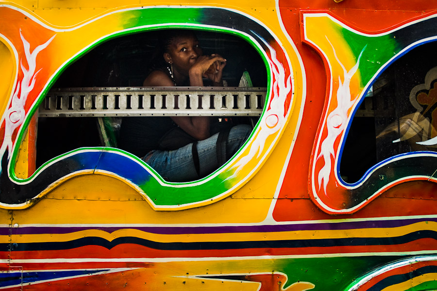 A Haitian girl looking out of the window of the tap-tap bus in Delmas, Port-au-Prince.