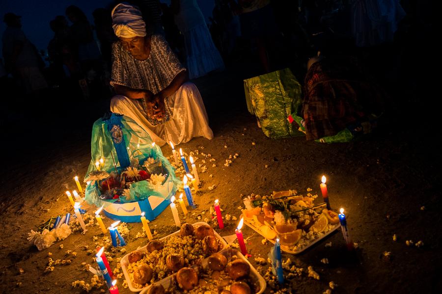 A devotee of Umbanda, the Afro-Uruguayan religious tradition, pays homage the goddess Yemanjá during a ritual ceremony on the seashore in Montevideo, Uruguay.