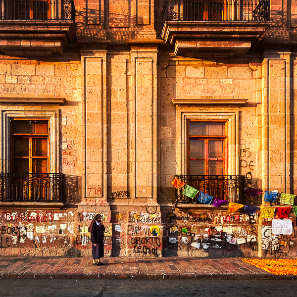 A Mexican nun looks at the Altar de Muertos, a religious site honoring the deceased, during the Day of the Dead celebrations in Morelia, Michoacán, Mexico.