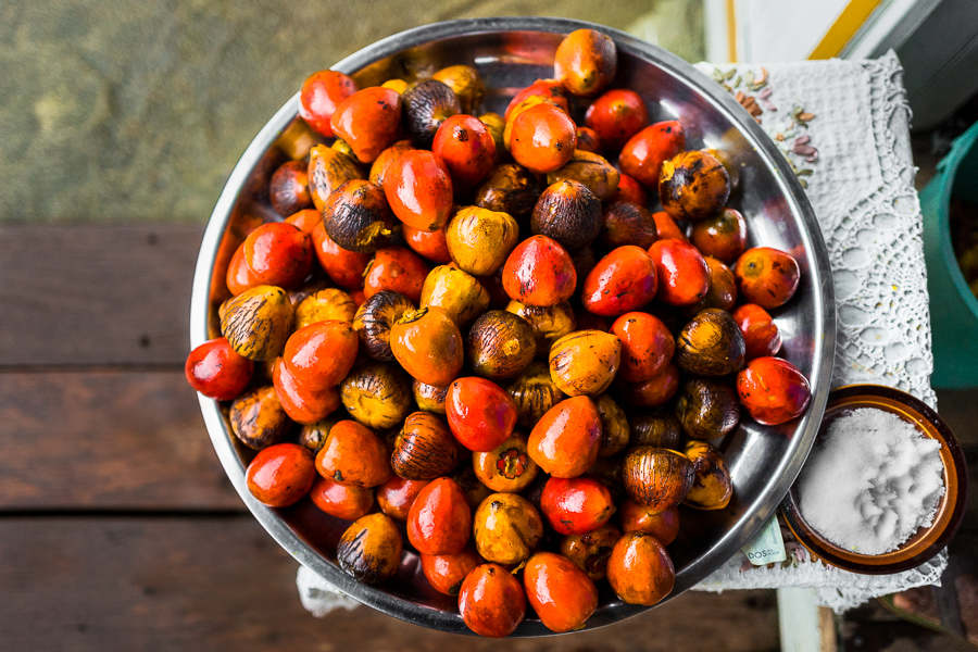 Freshly cooked chontaduro (peach palm) fruits are seen offered for sale in front of a house in Quibdó, Chocó, Colombia.