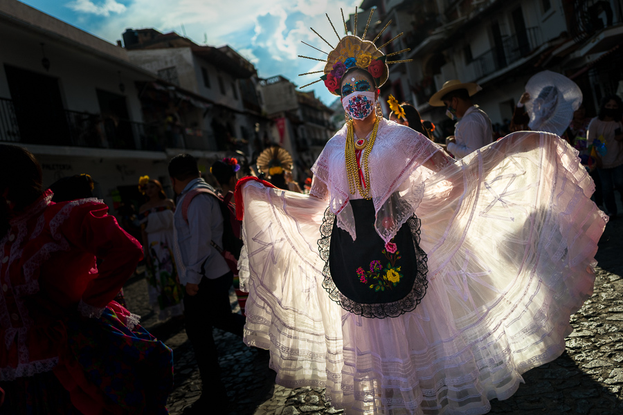 A young Mexican woman, dressed as La Catrina, performs during the Day of the Dead (Día de Muertos) celebrations in Taxco, Guerrero, Mexico.