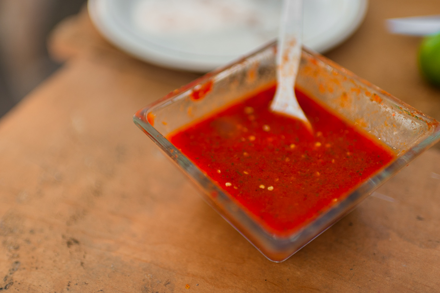 A small bowl of hot salsa made of chiltepin peppers, a wild variety of chili pepper, is seen placed on the table in a farm near Baviácora, Sonora, Mexico.