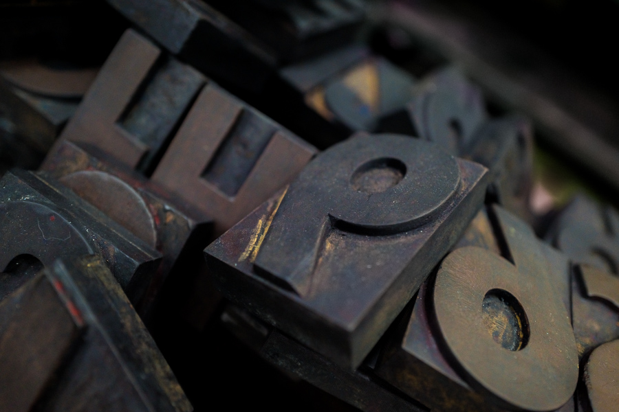 The movable wooden letterpress types are seen randomly stored in a tray at an antique printing workshop in Cali, Colombia.