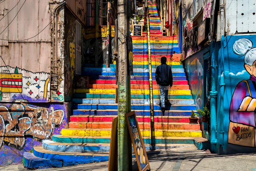 A Chilean man climbs the Escalera de Colores staircase on Cerro Concepción hill in Valparaíso, Chile.