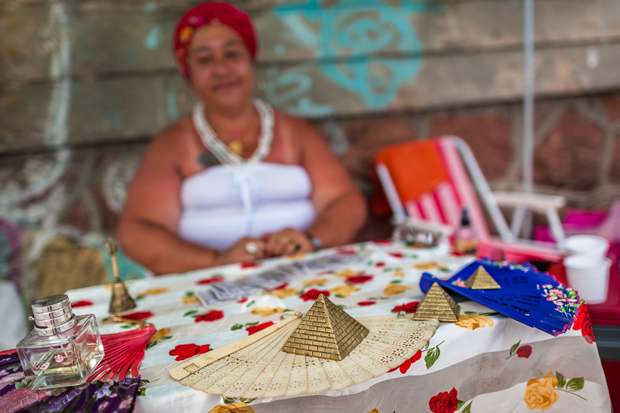 An Uruguayan woman, a worshiper of the Afro-Uruguayan religious tradition, offers esoteric services during a celebration in honor of the goddess Yemanjá on the seashore in Montevideo, Uruguay.