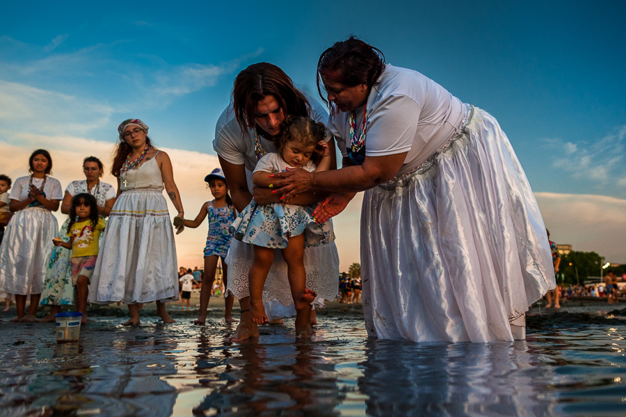 Devotees of Umbanda, the Afro-Uruguayan religious tradition, perform a ritual blessing with seawater in honor of the goddess Yemanjá on the seashore in Montevideo, Uruguay.