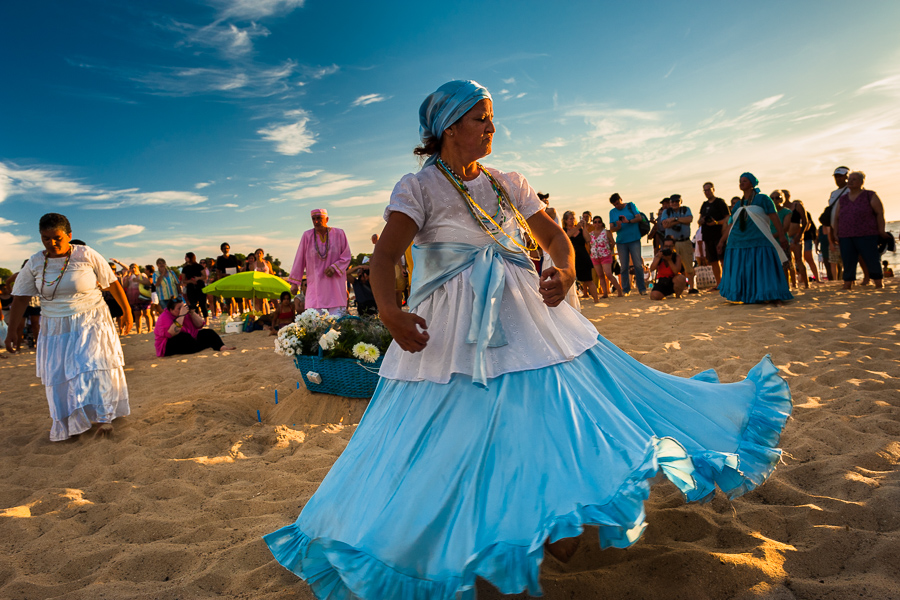 Devotees of Umbanda, the Afro-Uruguayan religious cult, dance around the temporary altar to pay tribute to the goddess Yemanjá during a ritual ceremony on the seashore in Montevideo, Uruguay.